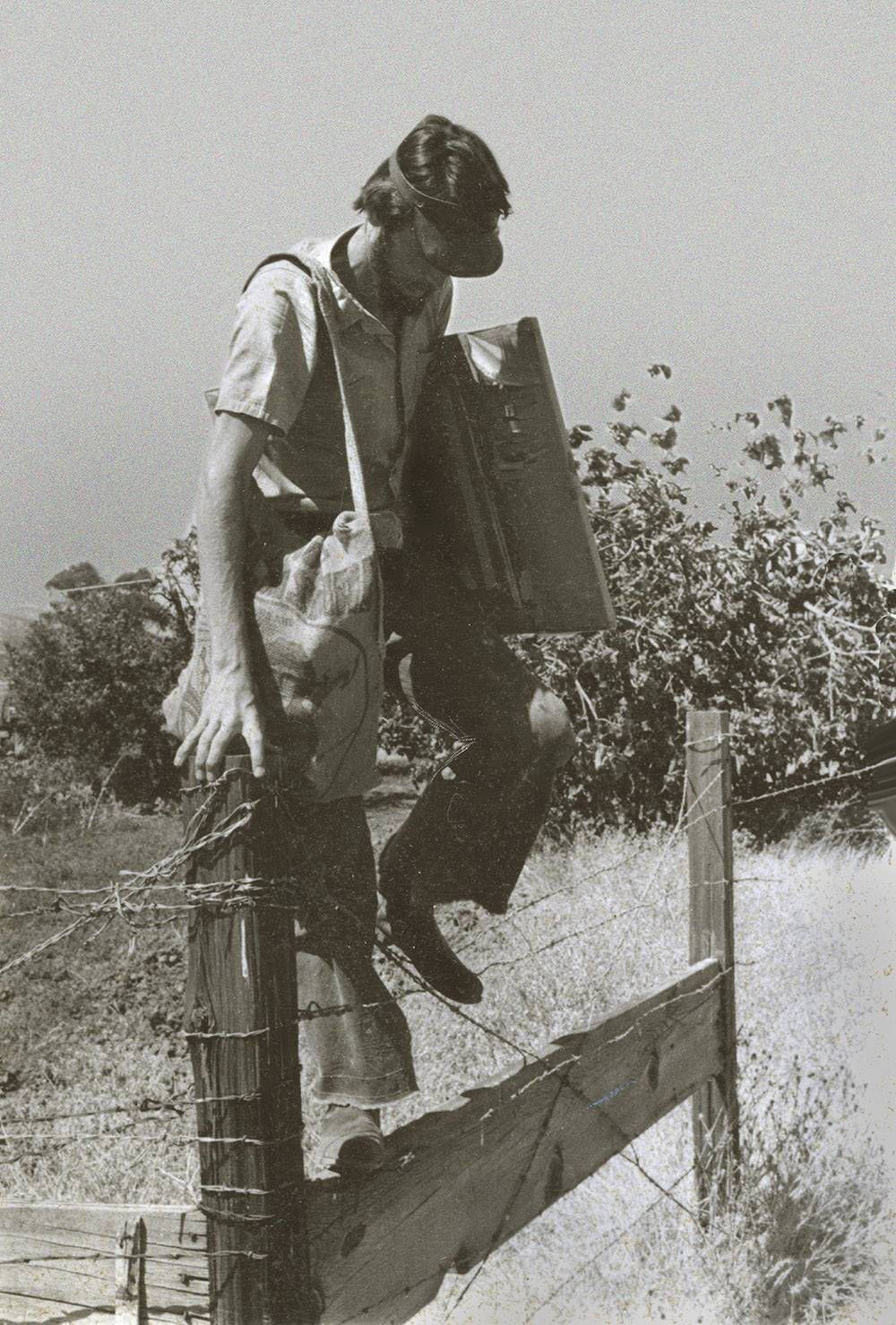 Black and white photograph of Stephen Duren fence hopping in California